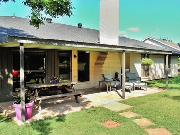 24ft x 12ft attached galvanized steel patio cover with low rib 26ga top and bent formed trim.