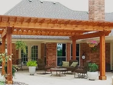 20ftx20ft Galvanized steel framed carport with a 10ft walkway cover all trimmed with cedar wood.