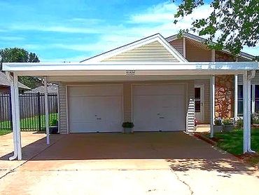 20ft x 20ft 6" steel attached carport that the red steel framing components has been painted white