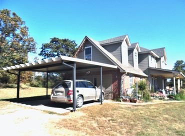 20ft X 20ft attached rolled formed aluminum carport with a Santa-Fe (Alumawood) package Clay/Bronze