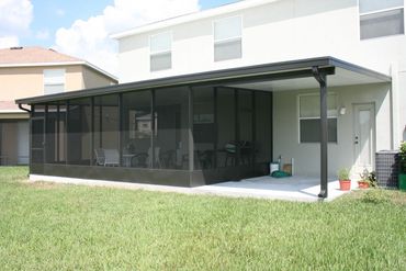 Combination screen room / patio cover in bronze with structural insulated panel,.