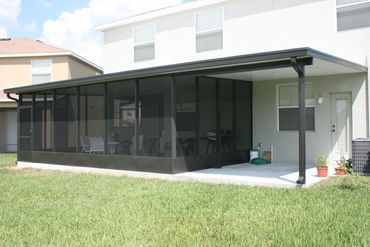 Combination screen room / patio cover in bronze with structural insulated panel,.