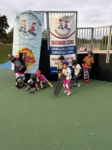 Glen Ellyn Students in front of Skate Lessons Chicago Banner and Flips Beef of Glen Ellyn banner