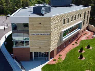 Aerial drone photo of new Minnetonka High School vantage momentum education building.