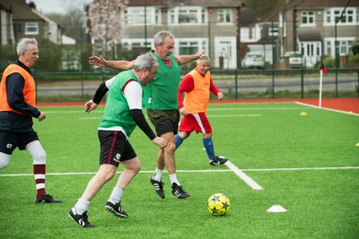 Older men playing football.
Photo by Age Cymru on Unsplash