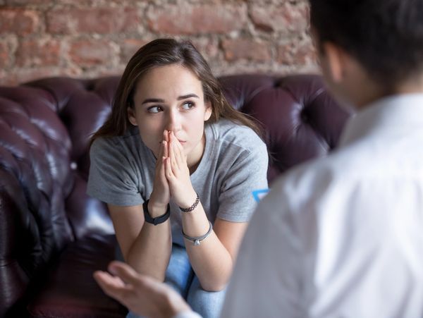 Young woman visiting the therapist.