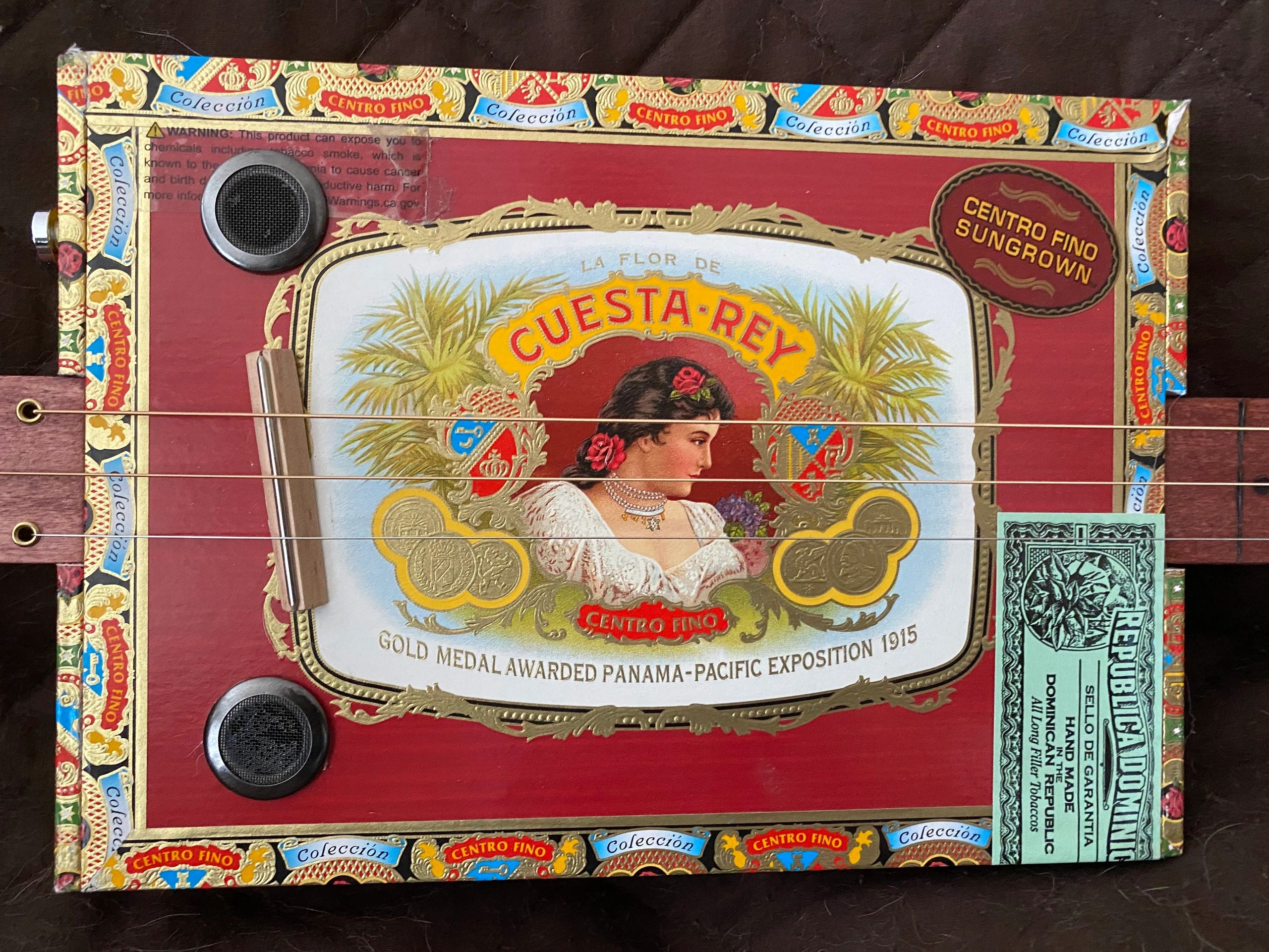 Actual 3-String Fretless Cigar Box Guitar that is featured in this program.