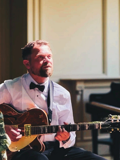 Personalised guitar instruction with Charlie Hodgson in a countryside estate music room