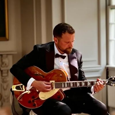 Charlie Hodgson playing jazz guitar live at stately home event. Country estate in Buckinghamshire