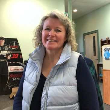 Tonya church secretary in grey vest in church office