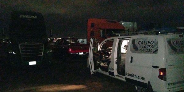 California Locksmith mobile locksmith van surrounded by diesels on a job.