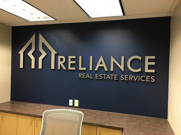 a lobby reception sign installed on the wall