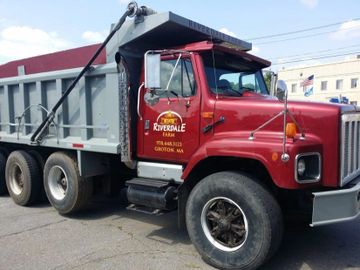 a dump truck with truck decals installed on it. 