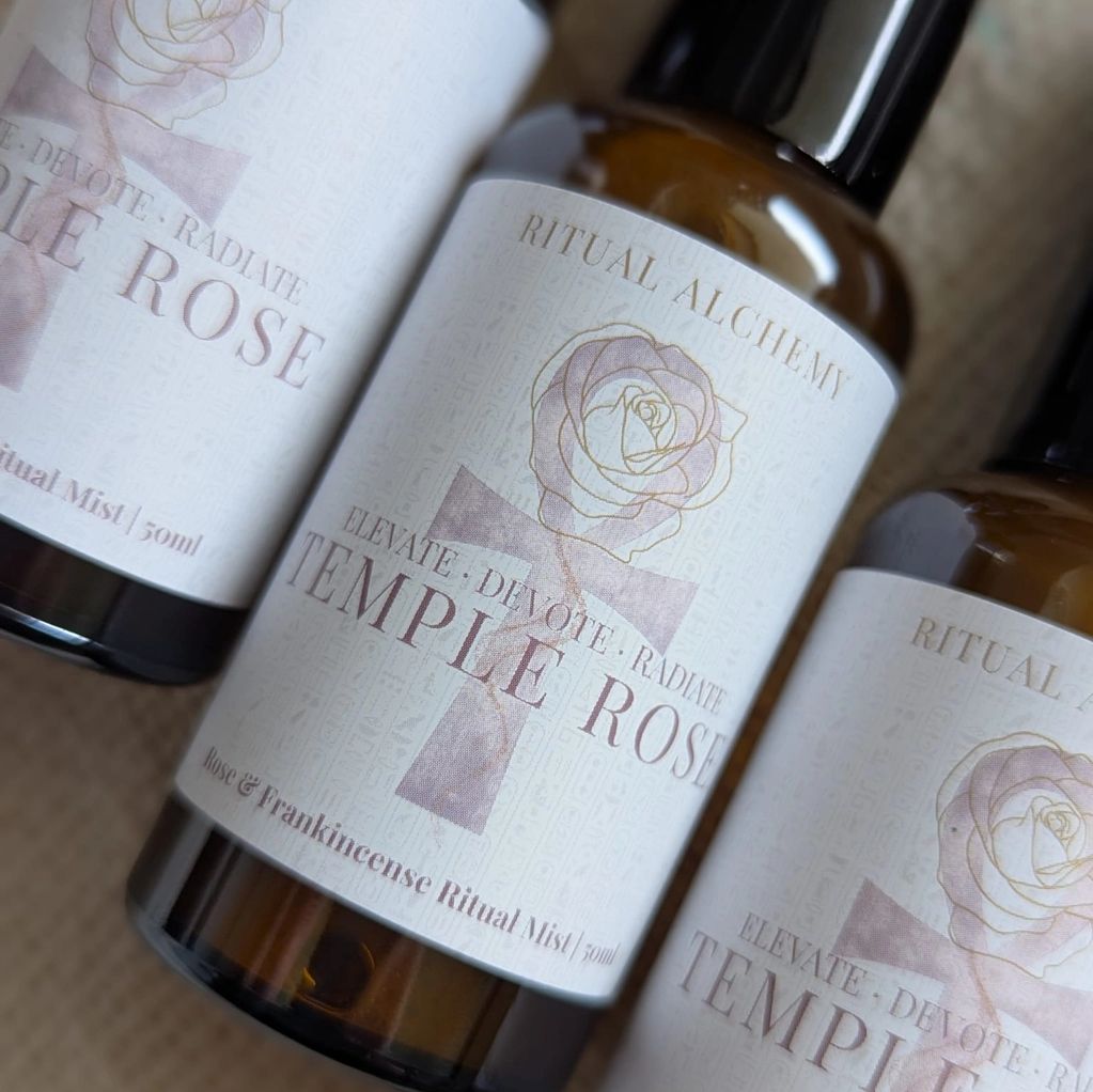 Bottles of Temple Rose ritual mist with rose and frankincense.