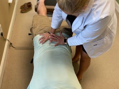 chiropractic adjusting drop low back pain