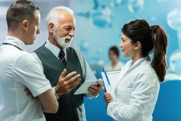 Doctors discussing patient information in a hospital.