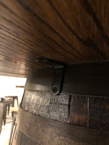 Heavy duty hardware is used to fasten the hefty table top to the barrel. This allow easy movement o