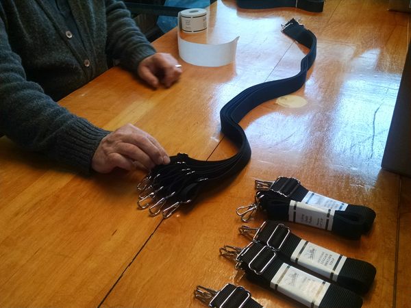 Shoulder Straps being assembled and labeled in our factory.