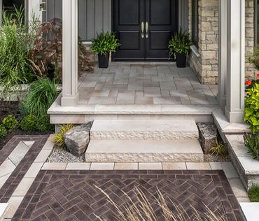 “A welcoming entrance built with natural stone, clean lines, and lasting craftsmanship.”