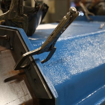 The assembly process of a VibraPro vibratory conveyor merges fiberglass and metal components.