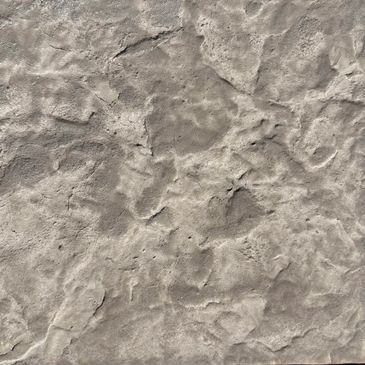 Close-up of a rough, textured stone surface.