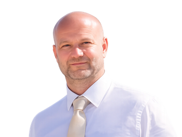 Smiling bald man in a white shirt and beige tie.