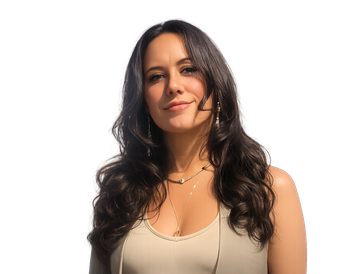 A confident woman with long curly hair and a microphone headset.