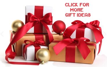 Stack of gift boxes wrapped with red ribbons and Christmas ornaments.