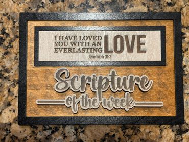 Wooden plaque with a Bible verse about everlasting love from Jeremiah 31:3.