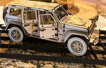 Image of a wooden Jeep hand made from Basswood.