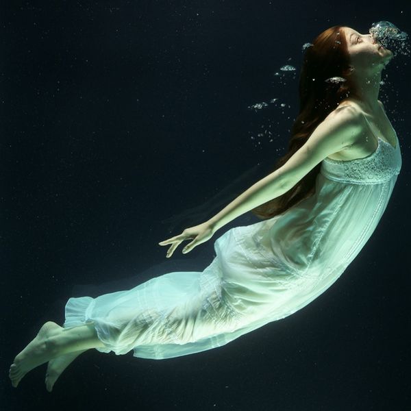 Girl in a dress underwater 