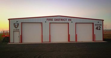 Large white and red building for Fire District #4 with large installed signage