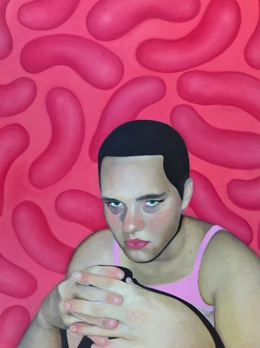 Portrait of a person with intense gaze against a vibrant pink background.