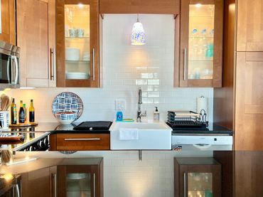 An example of Nest + Feather's home staging service showing a bright kitchen with a large island