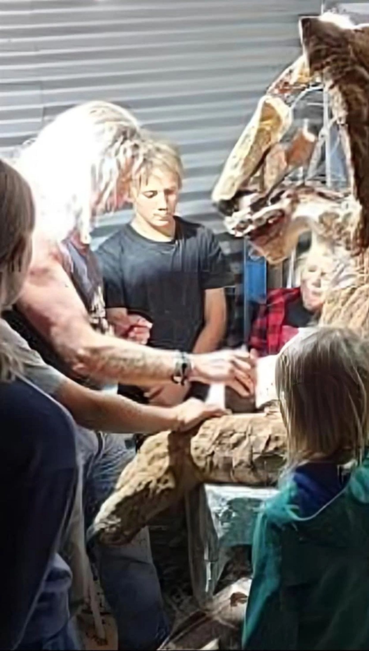 Cal the Stoner showing visitors to the studio how an Intricarved stone sculpture works.