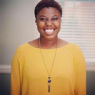 Woman wearing yellow smiling for a professional photo