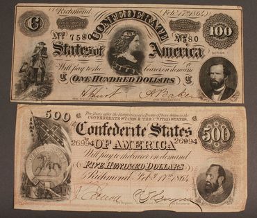 Historic Confederate States currency from 1864 showing $100 and $500 bills.