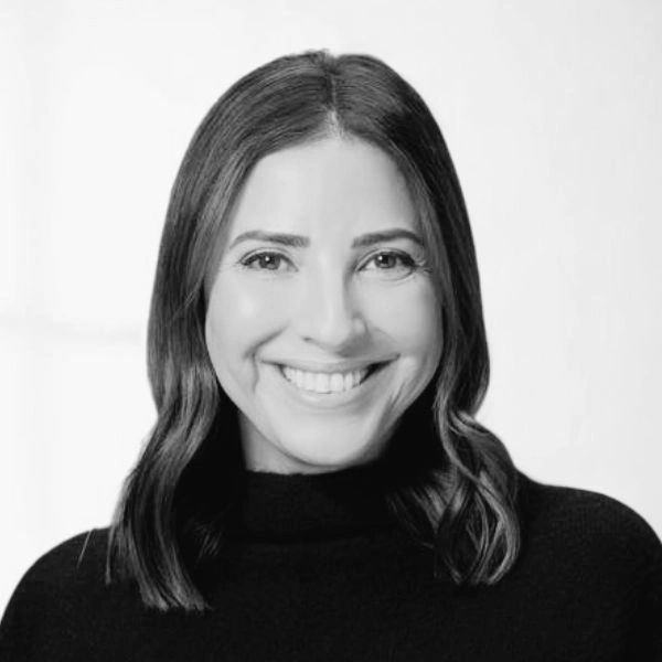 black and white headshot of a woman smiling