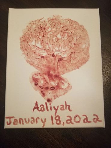 A red ink handprint artwork labeled Aaliyah with a date.