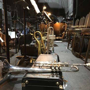 Image of a variety of trumpets and equipment on stage before the Stix Concert. 