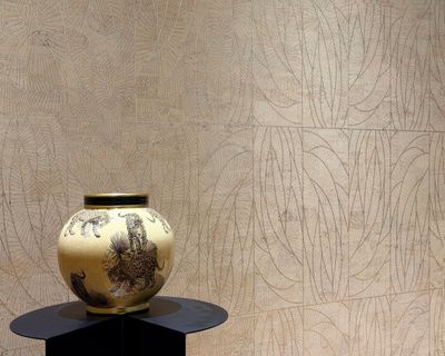 Bespoke laser-etched cork wallcovering featuring natural texture, intricate detailing, and handcraft
