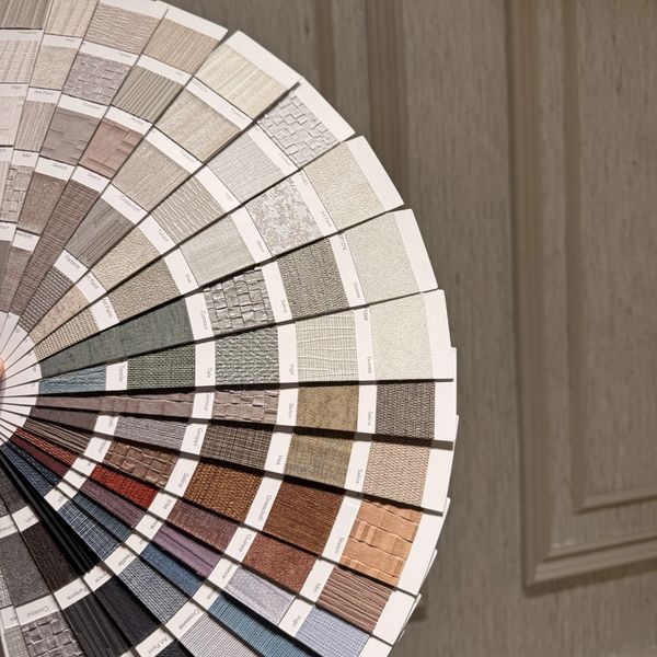 Fan-shaped display of textured color samples.