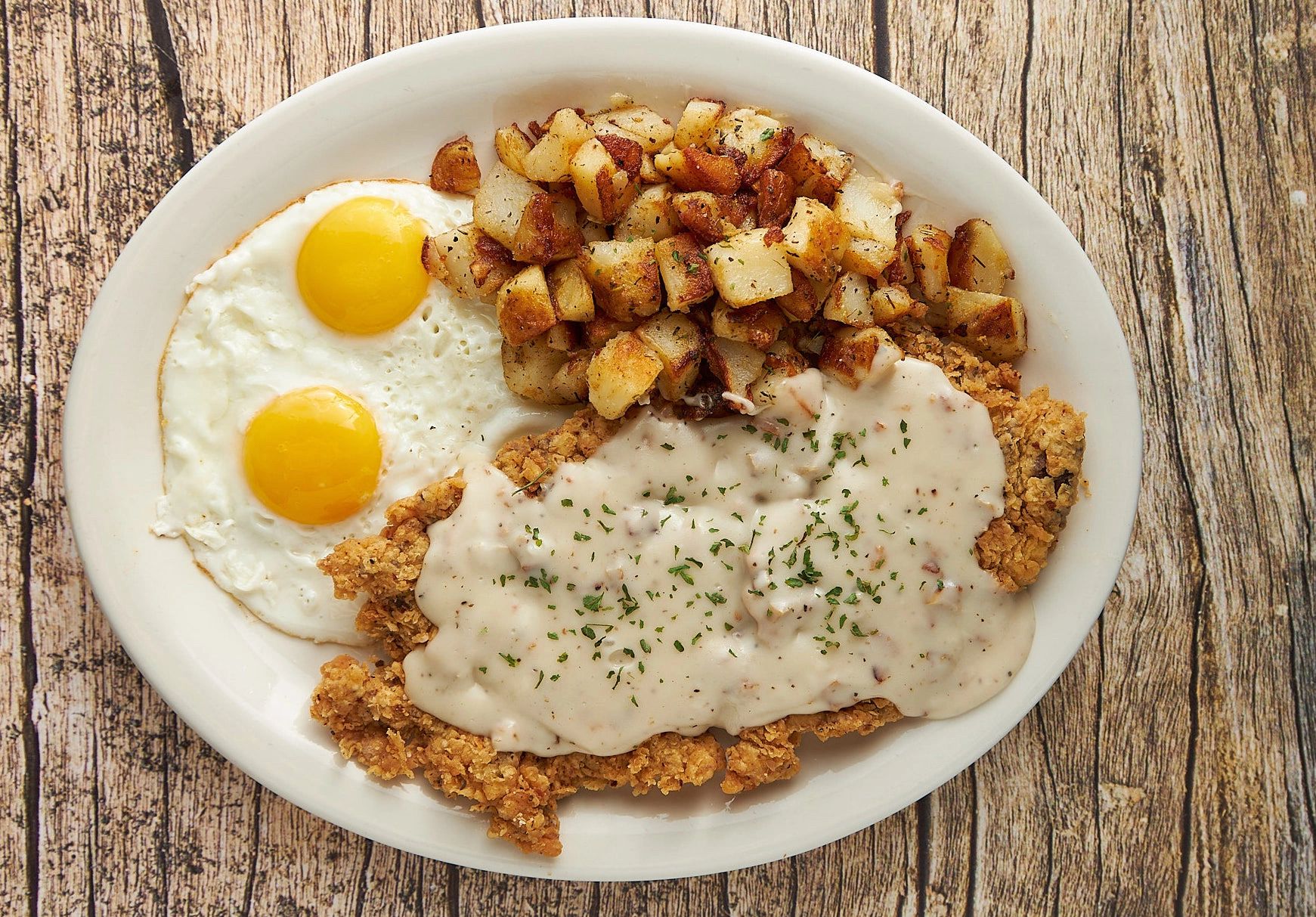 OUR DELICIOUS HOMEMADE COUNTRY FRIED STEAK