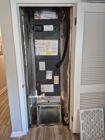 3 ton Goodman air handler installed with a 2"filter and auxiliary drain pan to protect the floor.