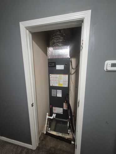 3 ton Goodman air handler installed in a 2nd floor closet with a auxiliary pan to protect the floor and ceiling below.