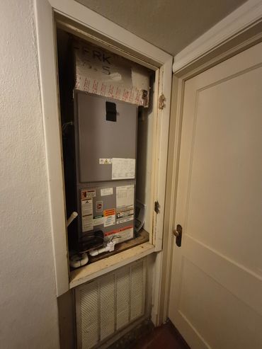 3 ton Rheem air handler unit in a small closet space.