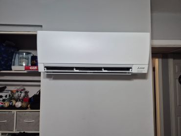 Wall-mounted Mitsubishi Electric air conditioner.