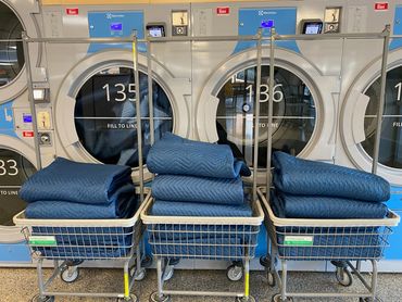 Inside the laundry shop with folded blankets