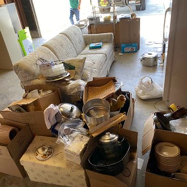 multiple items in a garage ready for junk removal.