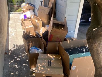 Pile of cardboard boxes and packing materials awaiting recycling pickup in San Francisco by JYR Junk Removal